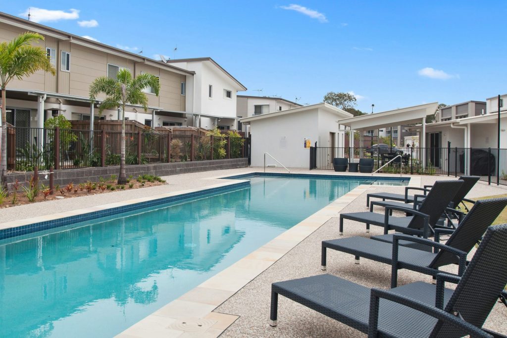 loungers near swimming pool